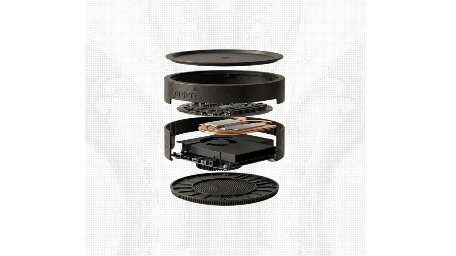 Exploded view of the real ERIKA computer showing its lid, enclosure, boards, cooling assembly, and base