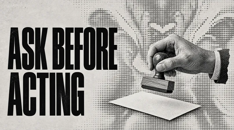 A hand holding a rubber stamp above a blank sheet of paper