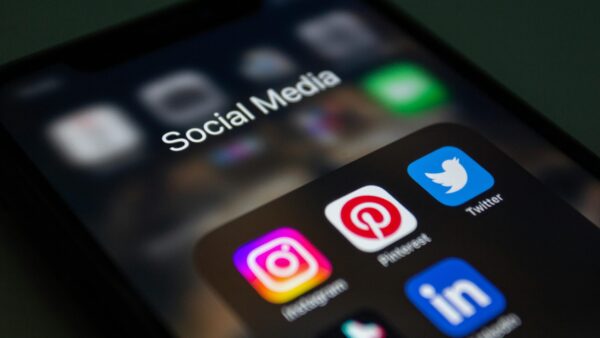 Experts analyzing social media data to determine the best marketing strategies for real estate educators.