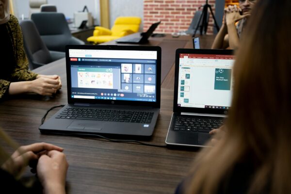 Marketing team collaborating on a webinar funnel setup for online courses and student enrollments.